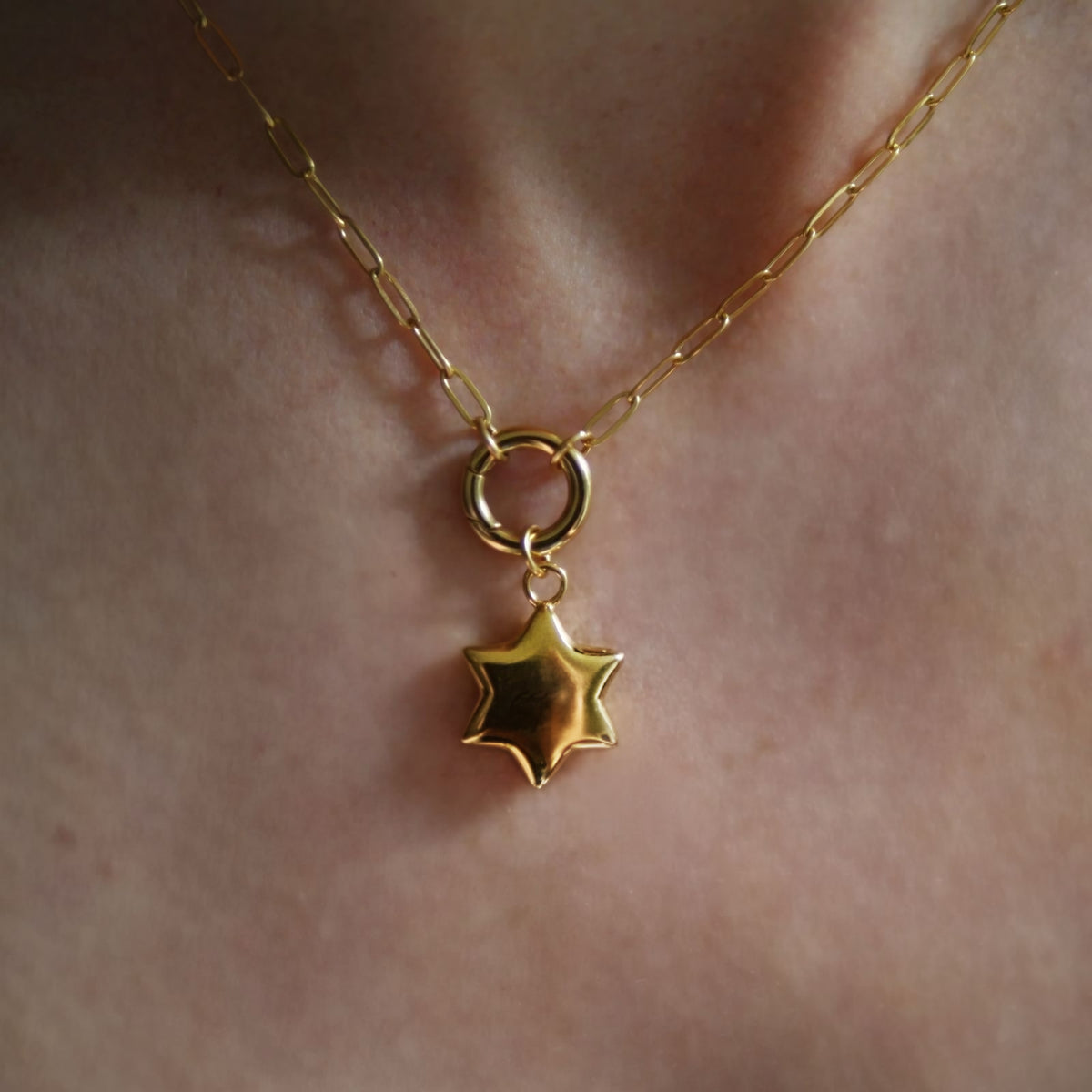 Bubble star charm on push clasp necklace
