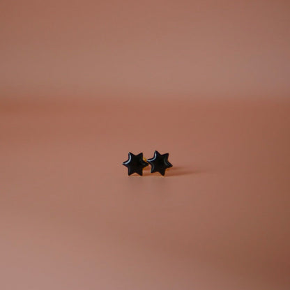 Black pair of Jewish star studs in enamel
